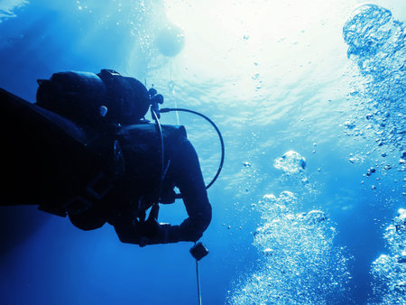 Scuba Diver at Safety Stop Underwater Bubbles, Sunlight
