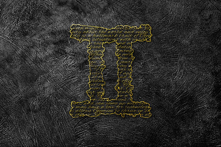 Gemini Zodiac Golden Sign on Black Grunge Backgroundの写真素材