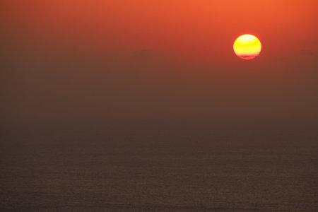 Dramatic coastal sunsets and wavesの写真素材