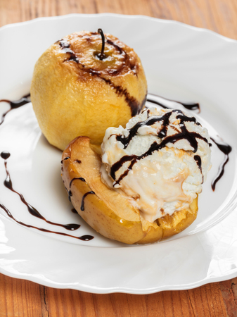 dessert baked apples with vanilla ice creamの写真素材