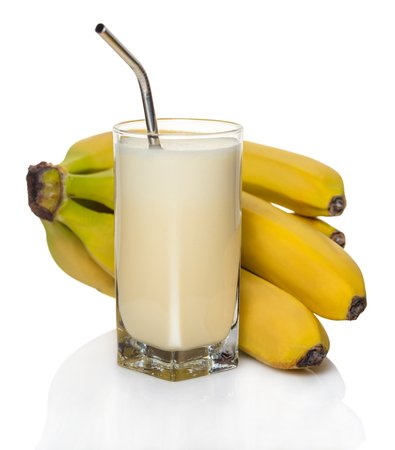 milk banana cocktail in a glass on white backgroundの写真素材