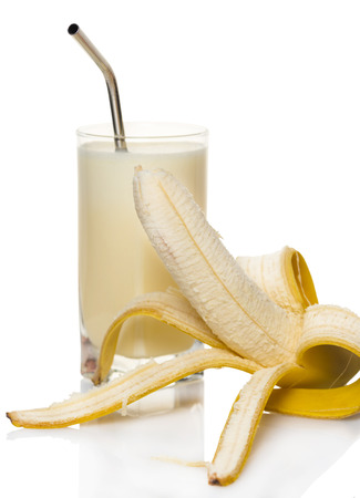 milk banana cocktail in a glass on white backgroundの写真素材