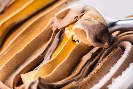 Spoon with chocolate ice cream close-upの写真素材