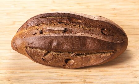 Rye bread closeup on a wooden background