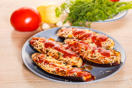Baked eggplants with cheese and vegetables in a dishの写真素材