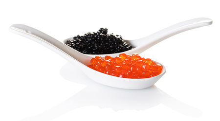 red and black caviar in spoon on white isolated backgroundの写真素材