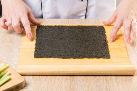 Japanese chef. Chef prepares rolls, hands closeupの写真素材