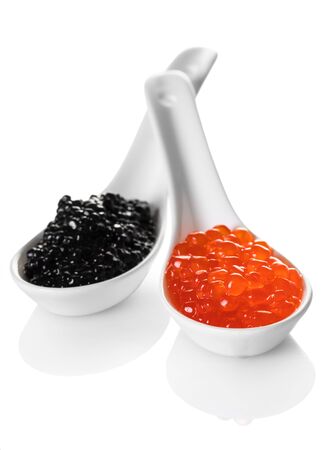 red and black caviar in spoon on white isolated backgroundの写真素材