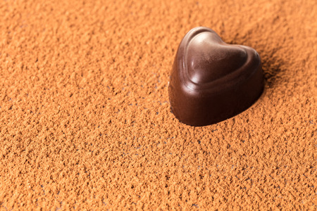 food background, chocolate candy in the shape of heartの写真素材