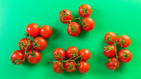food background, tomatoes on a green top viewの写真素材
