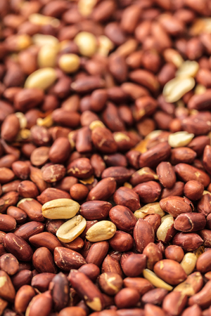 food background of a texture of roasted peanuts close-upの写真素材