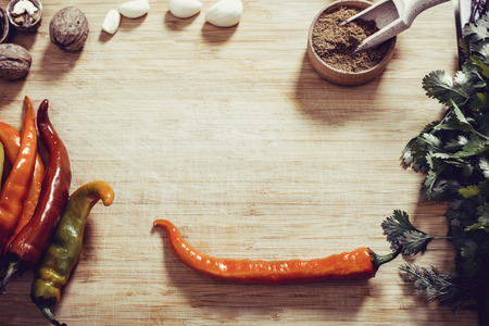 chili pepper with herbs and seasoning on wooden backgroundの写真素材