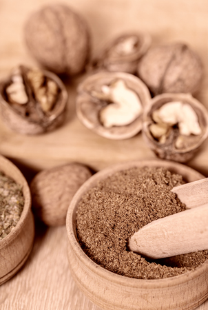 walnuts and dry spices close-up on wooden backgroundの写真素材