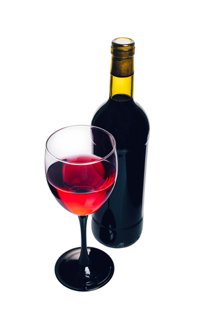 bottle and glass of red wine closeup on white backgroundの写真素材