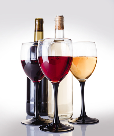 white and red wine on a light backgroundの写真素材