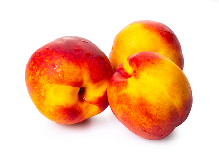 ripe nectarine close-up on white isolated backgroundの写真素材