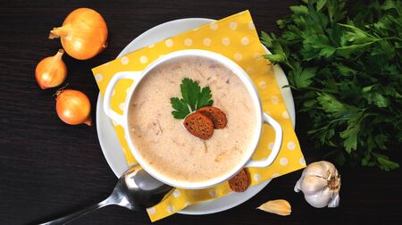 onion cream soup on a wooden backgroundの写真素材