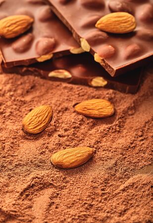 chocolate bar on a background of cocoa powder                               の写真素材