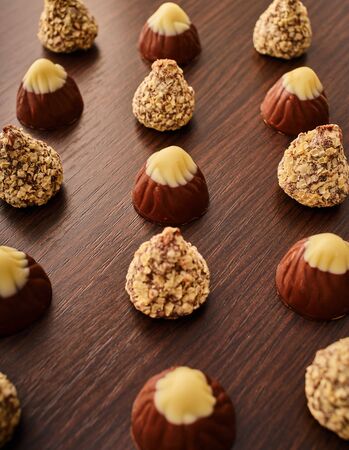 chocolate truffle candies close-up on a wooden background                               の写真素材
