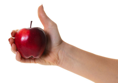 red apple in hand on white isolated backgroundの写真素材