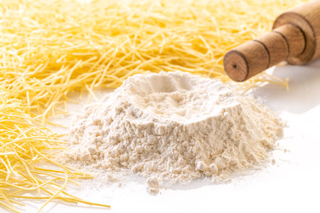 food background, flour and pasta closeup on whiteの写真素材
