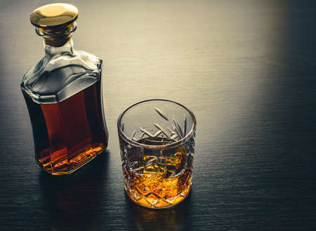 alcoholic drink, whiskey on brown wooden backgroundの写真素材