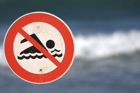 sign prohibiting bathing in the ocean, real stateの写真素材