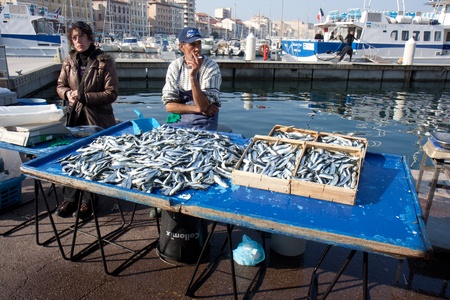 MARSEILLE, FRANCE, MARCH 6: fishmongers on the open-air market of the Vieux-port, on Sunday, March 6th, 2011, in Marseille, Franceのeditorial素材