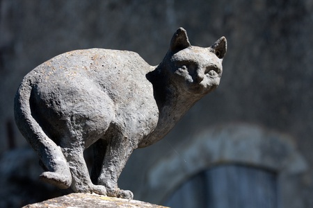 LA ROMIEU, FRANCE, APRIL 5: Sculpture of a cat on April 5, 2011, in La Romieu, France. Follow to the traces of "Angeline and her cats" a girl who saved the village with her cats in the middle age. のeditorial素材