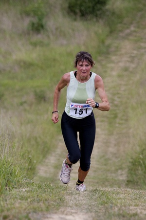 PAVIE, FRANCE - MAY 22, 2011: woman running at the Trail of Pavie, on May 22, 2011, in Pavie, France.のeditorial素材