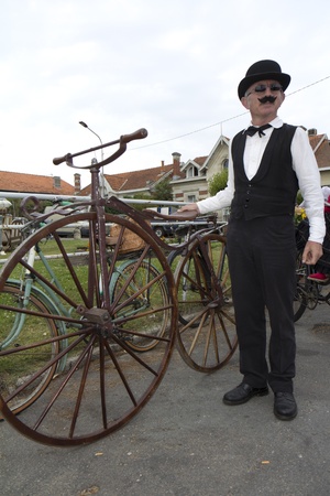 SOULAC SUR MER, FRANCE - JUNE 5, 2011: Biker with an old bicycle at the Soulac 1900 festival on june...
