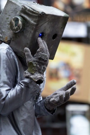AURILLAC, FRANCE - AUGUST 24: an actor is playing as a kind robot as part of the Aurillac International Street Theater Festival, show Robot Nozomi, on august 24, 2012, in Aurillac,France.のeditorial素材