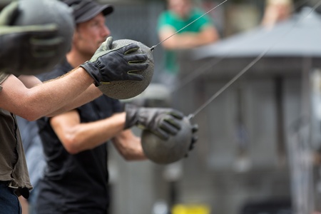 AURILLAC, FRANCE - AUGUST 24: strong men ready to throw some heavy balls as part of the Aurillac...