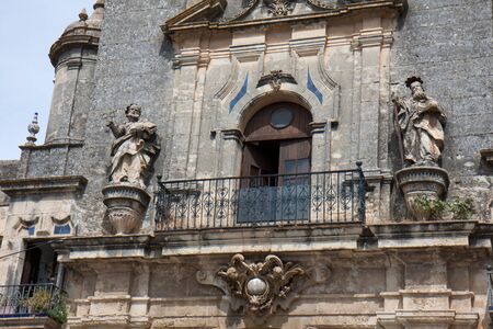 Part of facade with two statues, Arcos de la Frontera church, Andalusia, spain の写真素材