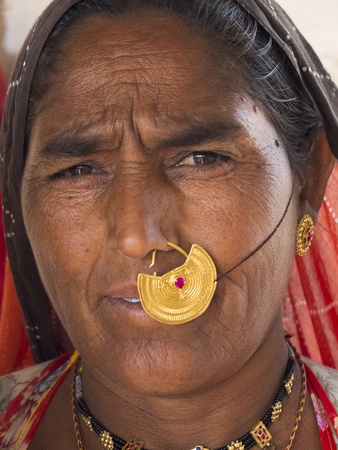 GHANERAO ,  INDIA - MARCH 10: closeup portrait of a Bishnoi woman wearing many jewels, March 10, 2013, Ghanerao, India. Bishnois are known as the first environment conservationists in the world.のeditorial素材