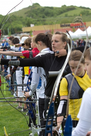AUCH, FRANCE - MAY 11:  group of competitors aiming with bow and arrow, at the National tournament for young archers, on May 11, 2013, in Auch, France. のeditorial素材
