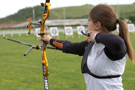 AUCH, FRANCE - MAY 11:  an unidentified female competitor is shooting with a bow and an arrow , at...