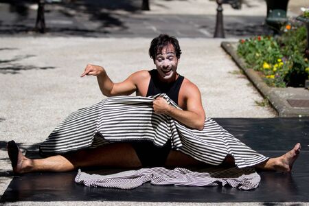 AURILLAC, FRANCE - AUGUST 21   a funny actor plays in the street  as part of the Aurillac International Street Theater Festival, Company Les hommes papillon,on august 21, 2013, in Aurillac,France のeditorial素材