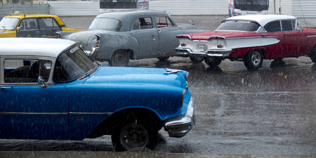 HAVANA, CUBA - NOVEMBER 21: vintage american car under a big rain, we november 21, 2014, in Havana, Cuba.のeditorial素材
