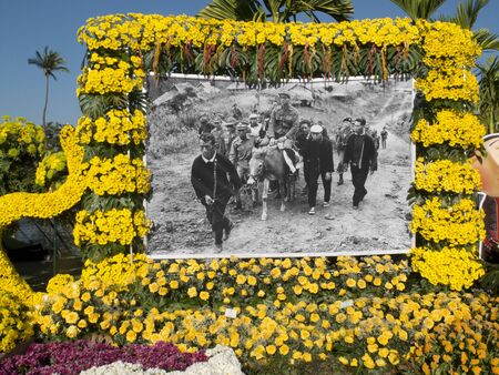 CHIANG MAI, THAILAND-FEBRUARY 4th 2017: Chiang Mai Flower Festival: yellow flowers bounding the picture of Thailand's King Bhumibol riding a horse .Thai people celebrate the very popular king, dead in 2016.のeditorial素材