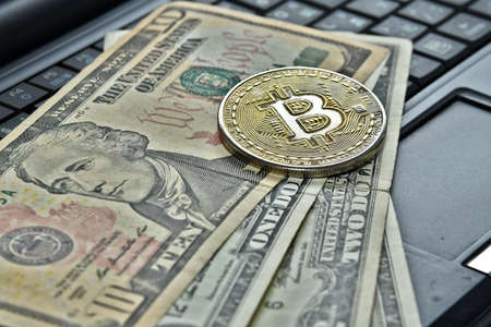 bitcoin coin on dollarsの写真素材