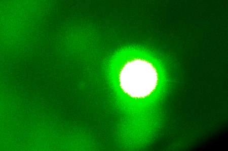 glowing green laser lightの写真素材