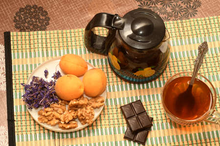 tea with sweets and fruitの写真素材