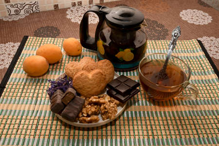 tea with sweets and fruitの写真素材