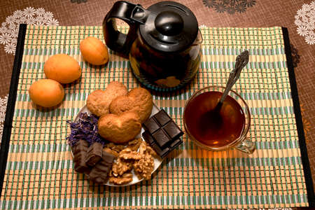 tea with sweets and fruitの写真素材