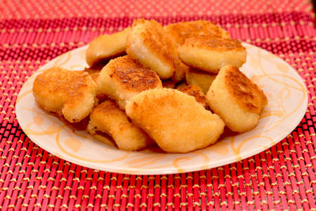 chicken nuggets on a plateの写真素材