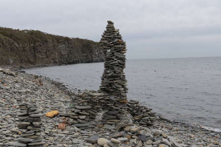pyramids of stones on the shore