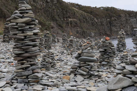 pyramids of stones on the shoreの写真素材