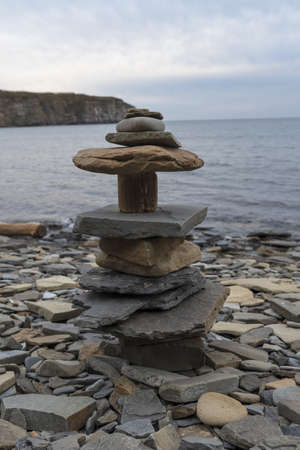 pyramids of stones on the shoreの写真素材