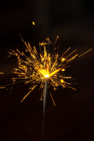 sparkler on a black background close-up, shallow depth of fieldの写真素材